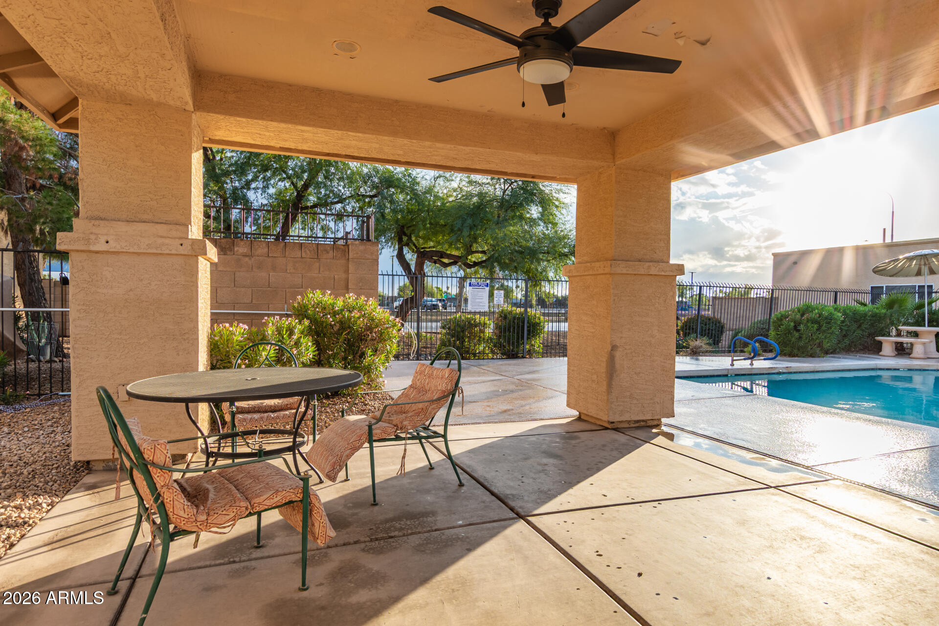 625 North Hamilton Street, Unit 26 Chandler, AZ 85225 - Photo 24 of 25 a view of a patio with a table and chairs under an umbrella