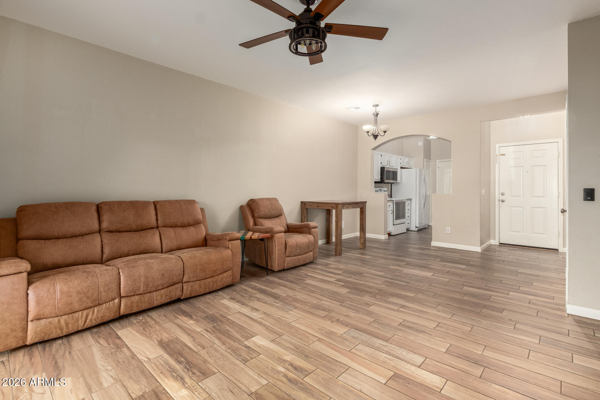 625 North Hamilton Street, Unit 26 Chandler, AZ 85225 - Photo 4 of 25 a living room with furniture and a wooden floor