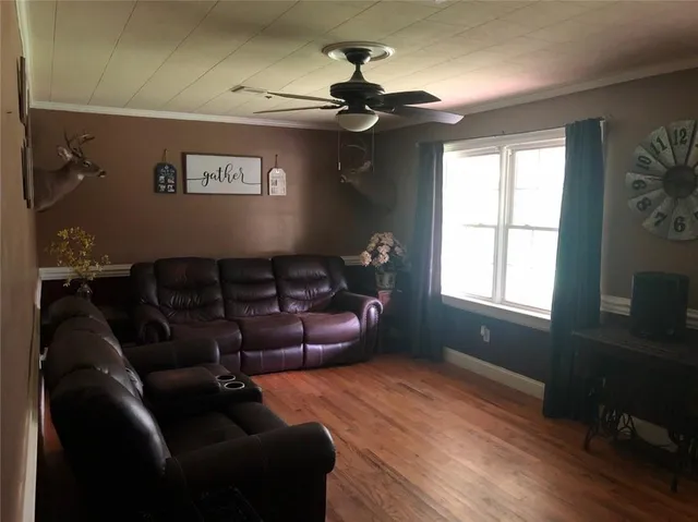 a living room with furniture and a window