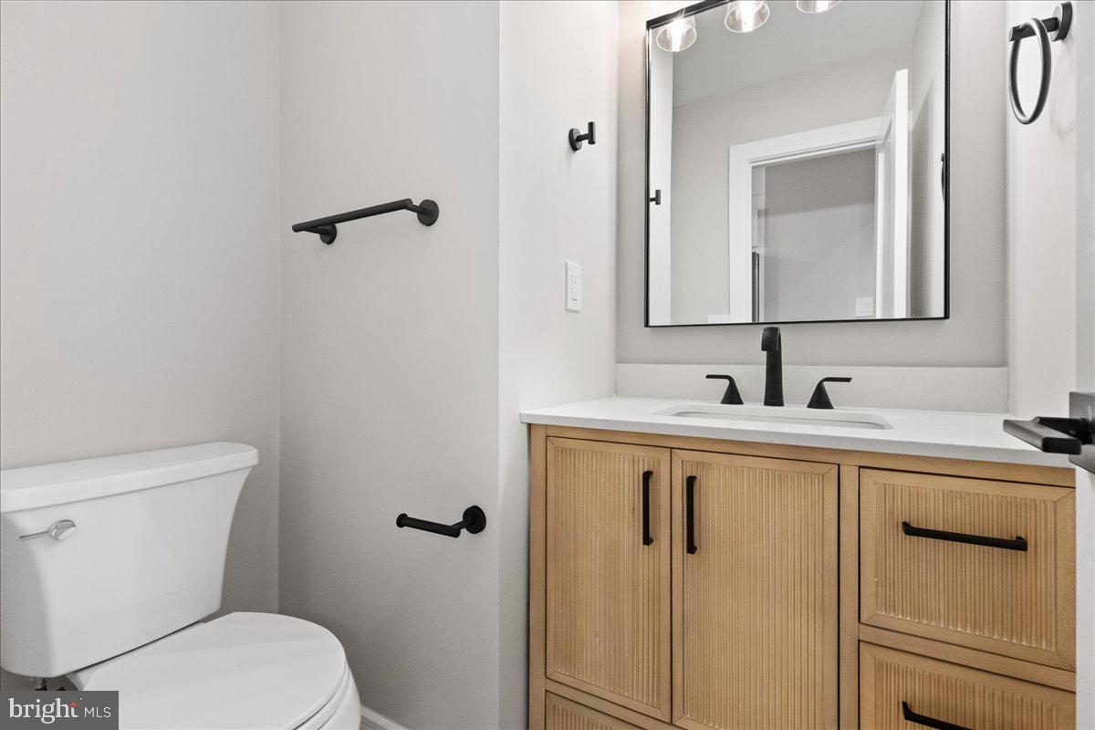 21 Andover Circle Princeton, NJ 08540 - Photo 14 of 31 a bathroom with a sink a toilet and mirror