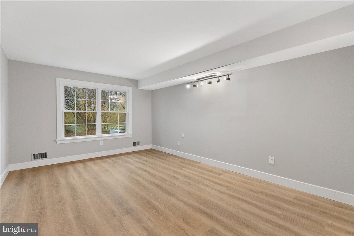 21 Andover Circle Princeton, NJ 08540 - Photo 15 of 31 wooden floor in an empty room with a window