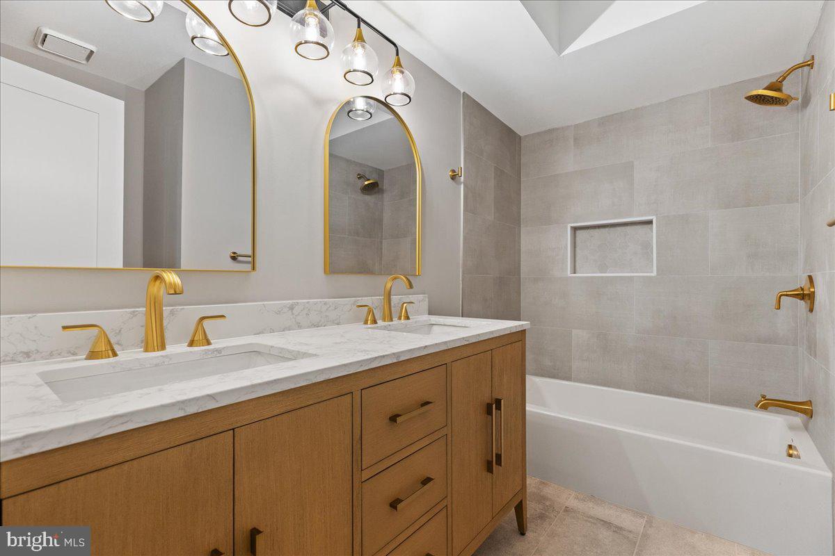 21 Andover Circle Princeton, NJ 08540 - Photo 18 of 31 a bathroom with a granite countertop sink mirror and a bathtub
