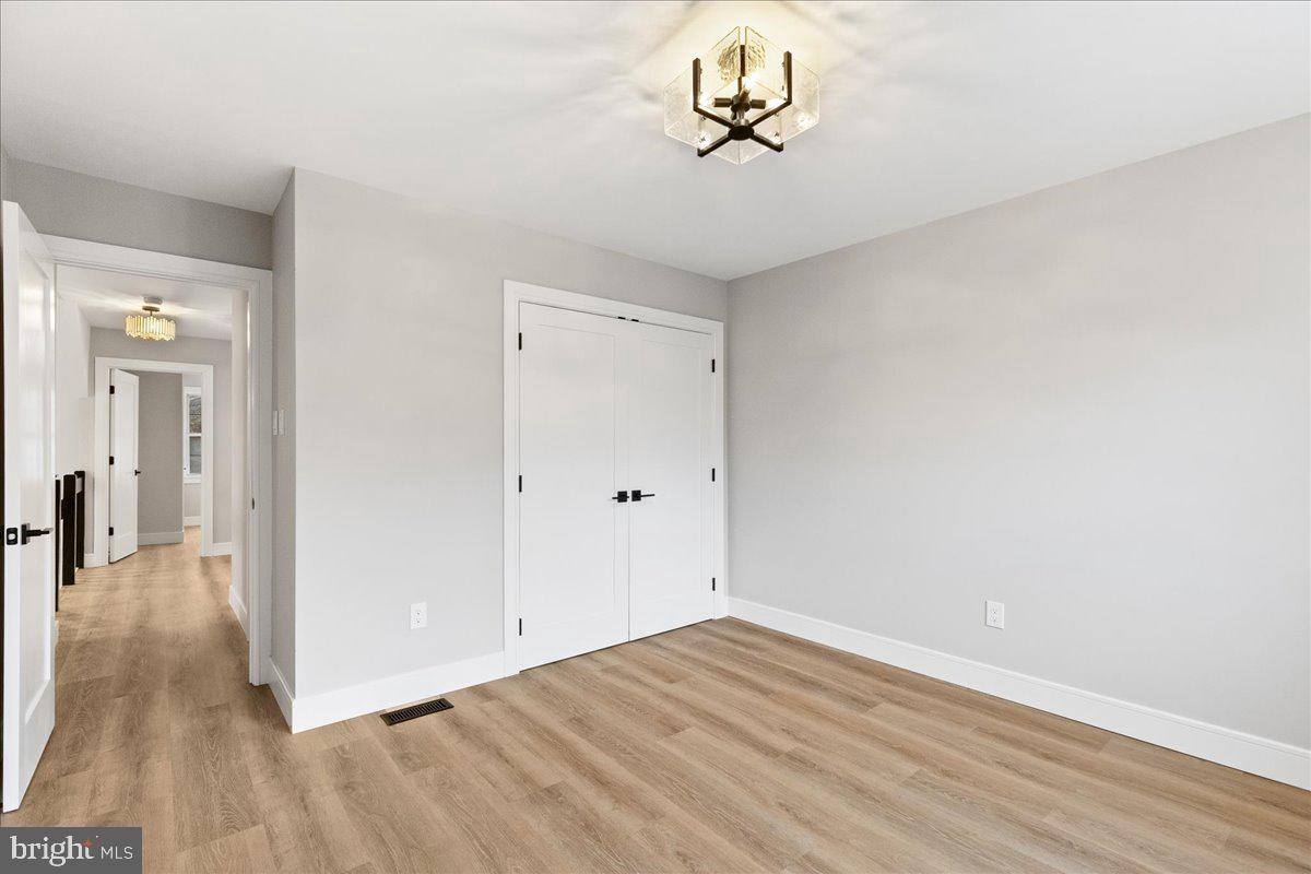 21 Andover Circle Princeton, NJ 08540 - Photo 25 of 31 a view of a room with wooden floor and a hallway