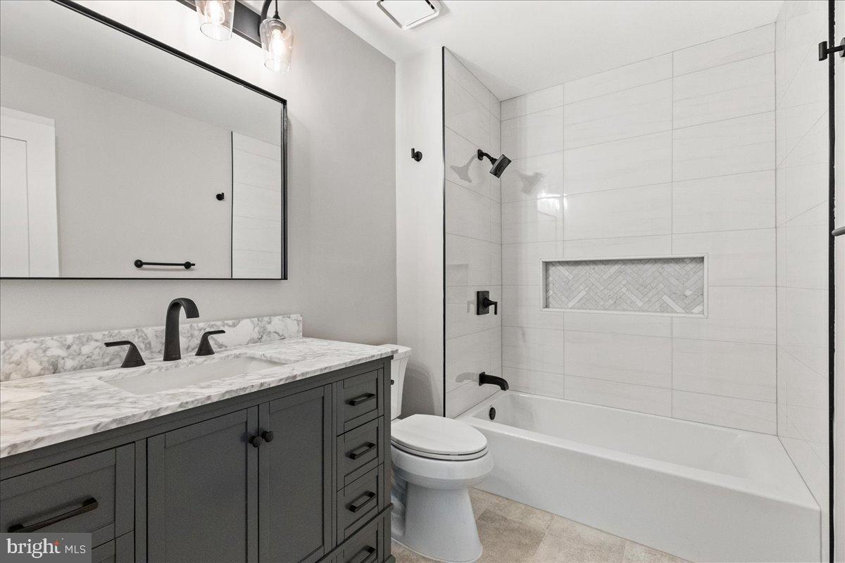 21 Andover Circle Princeton, NJ 08540 - Photo 26 of 31 a bathroom with a granite countertop sink toilet and shower