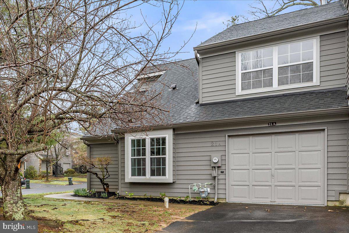21 Andover Circle Princeton, NJ 08540 - Photo 28 of 31 a front view of a house with a yard and garage