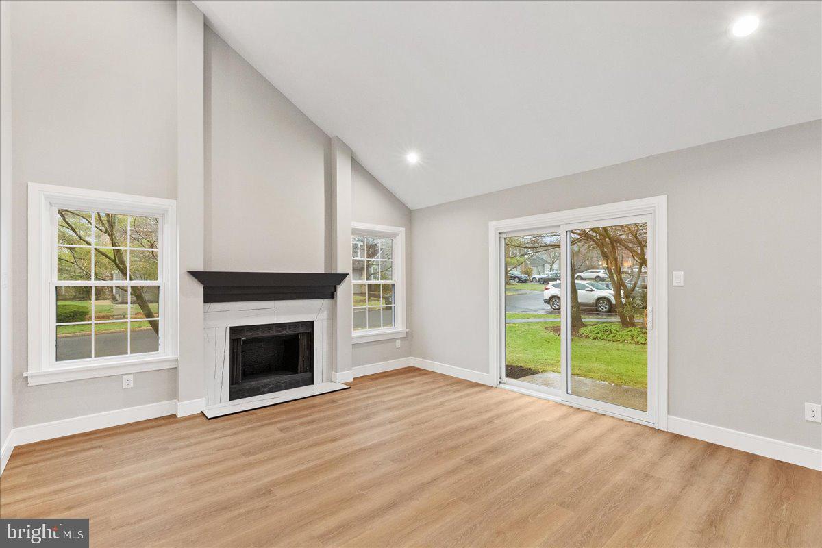 21 Andover Circle Princeton, NJ 08540 - Photo 4 of 31 a view of an empty room with a window and wooden floor