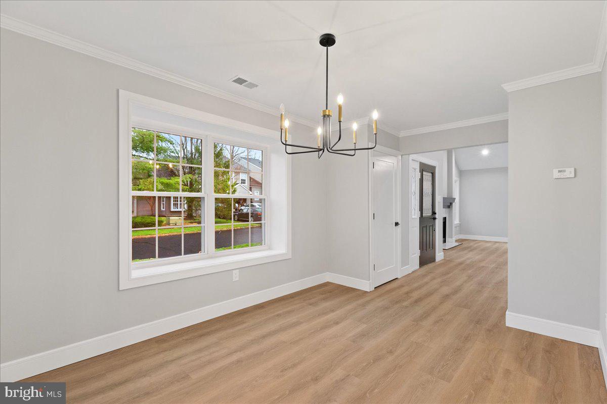 21 Andover Circle Princeton, NJ 08540 - Photo 7 of 31 a view of empty room with wooden floor and windows