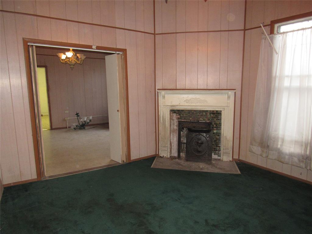 1622 North 6th Street Waco, TX 76707 - Photo 15 of 17 a view of a livingroom with a fireplace and window