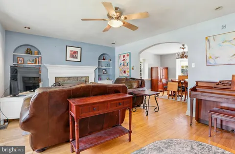 a bedroom with a bed a table and chair