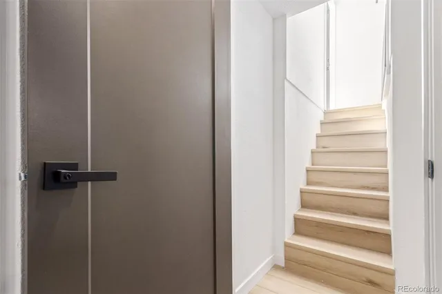 a view of staircase with white walls