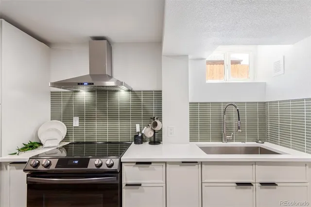 a sink sitting next to a window