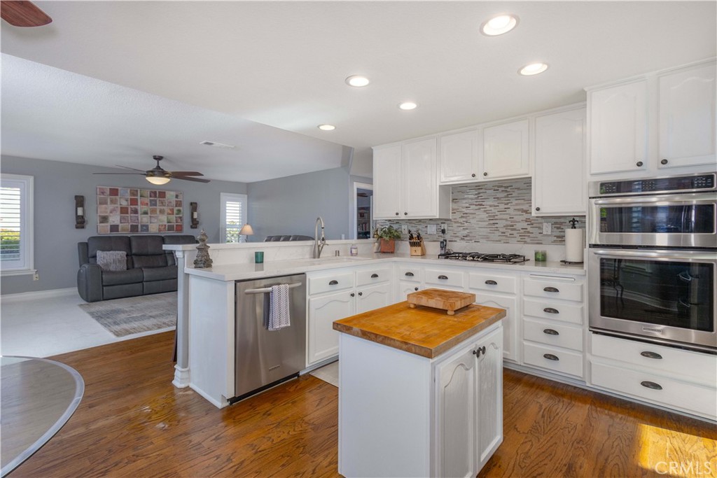 31858 Valone Court Temecula, CA 92591 - Photo 17 of 45 a kitchen with a stove a sink and a refrigerator