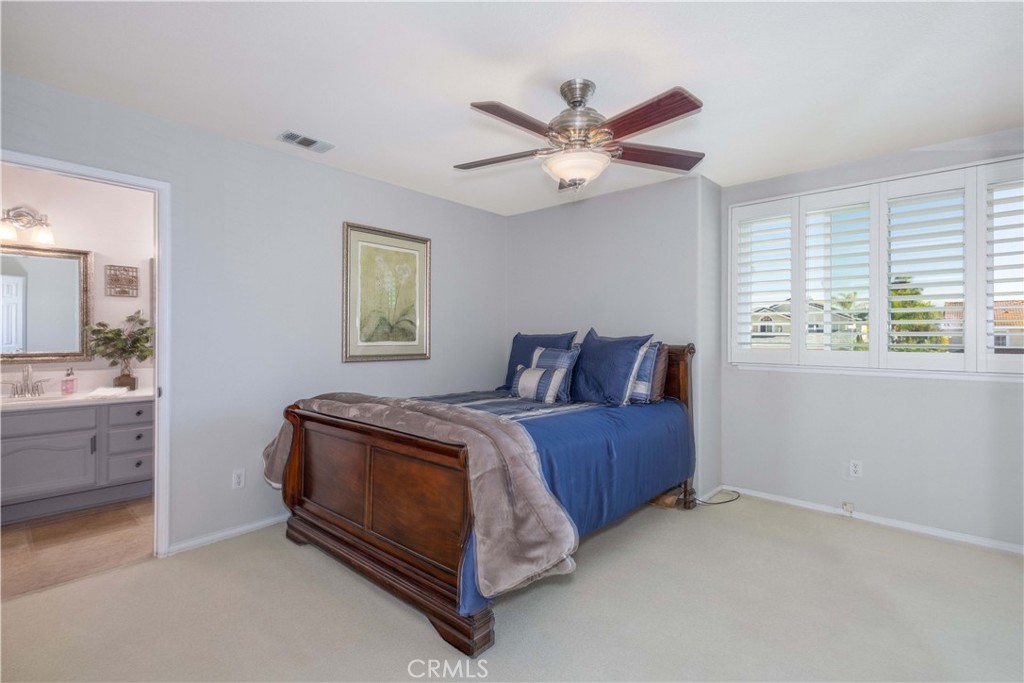 31858 Valone Court Temecula, CA 92591 - Photo 20 of 45 a bed room with a bed and a window
