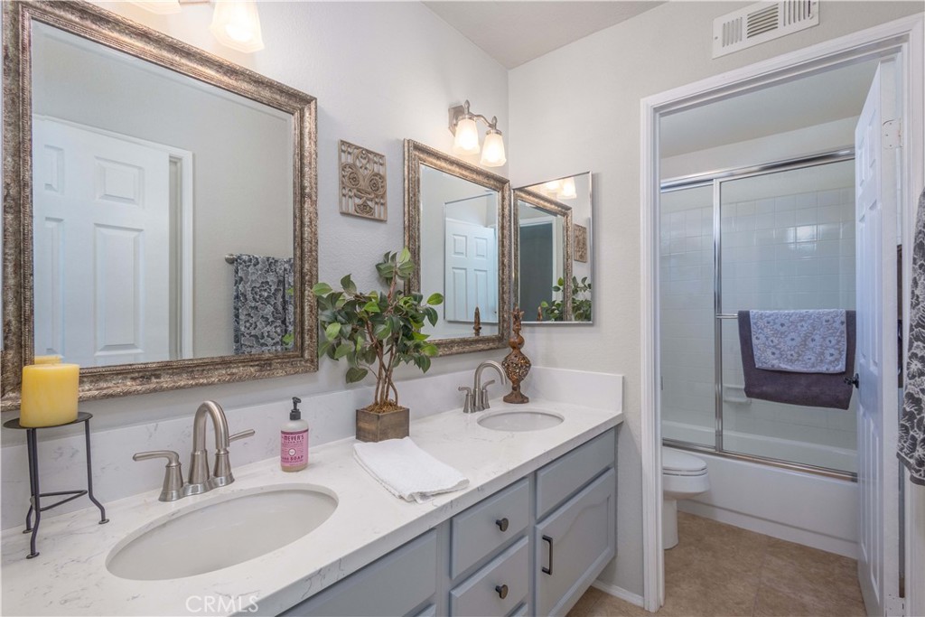 31858 Valone Court Temecula, CA 92591 - Photo 21 of 45 a bathroom with a sink and a mirror