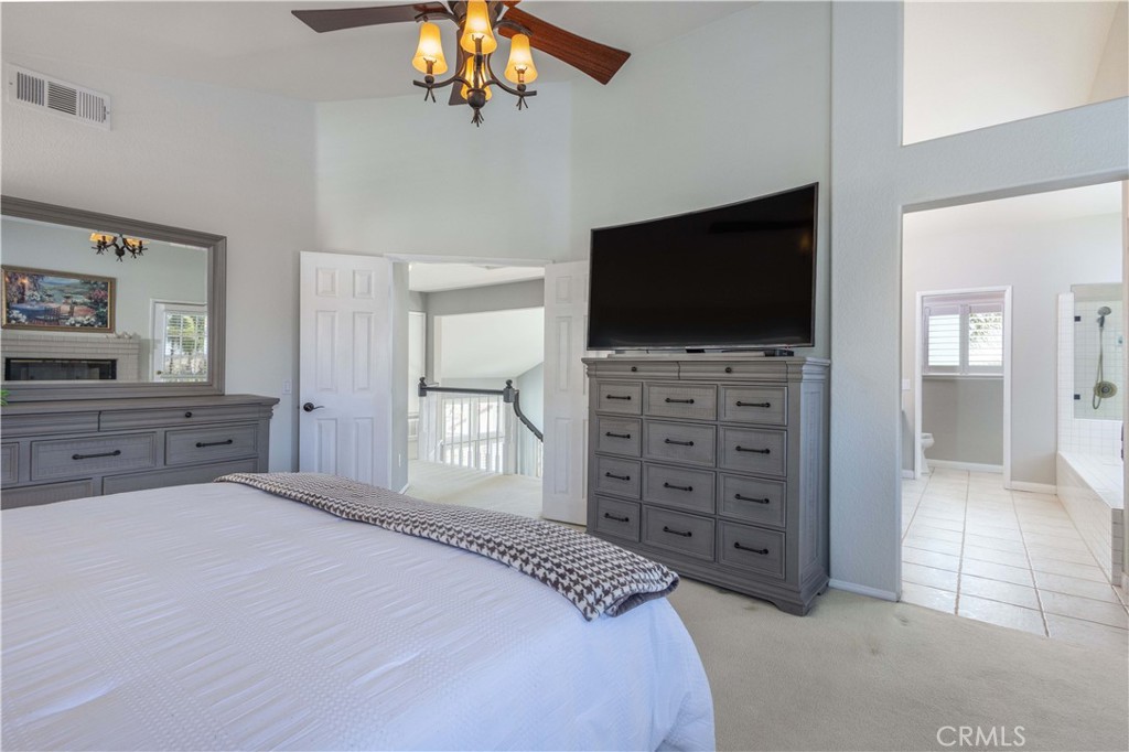 31858 Valone Court Temecula, CA 92591 - Photo 25 of 45 a bedroom with a bed and a flat screen tv