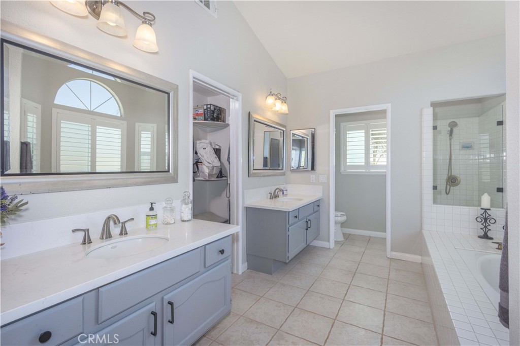 31858 Valone Court Temecula, CA 92591 - Photo 26 of 45 a spacious bathroom with a granite countertop sink mirror and bathtub