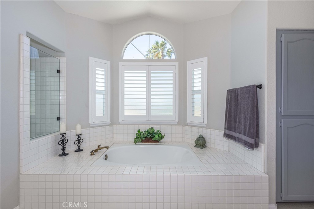 31858 Valone Court Temecula, CA 92591 - Photo 27 of 45 a white bath tub sitting in a bathroom next to a window