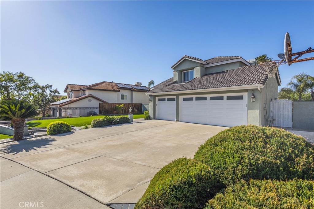 31858 Valone Court Temecula, CA 92591 - Photo 3 of 45 a front view of a house with a garden and a yard