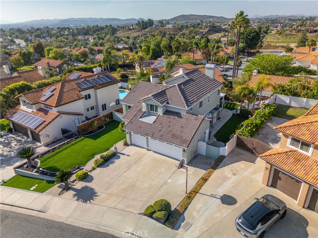 31858 Valone Court Temecula, CA 92591 - Photo 38 of 45 an aerial view of a house with a garden and lake view