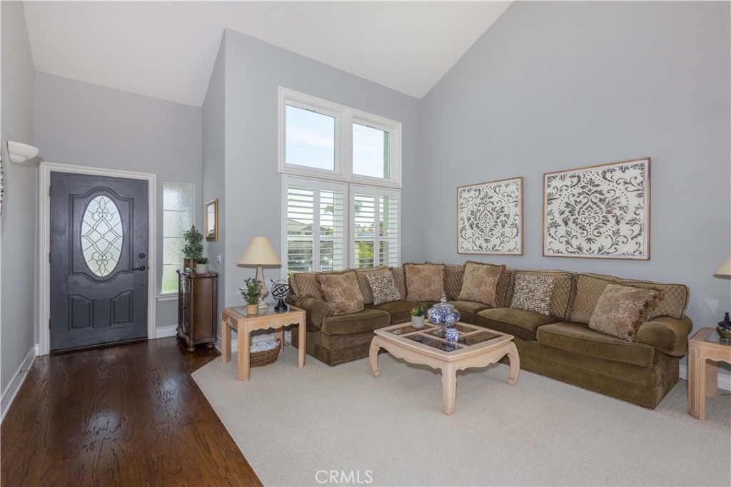 31858 Valone Court Temecula, CA 92591 - Photo 7 of 45 a living room with furniture a large window and a rug