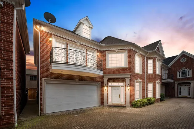 a front view of a house with a garage