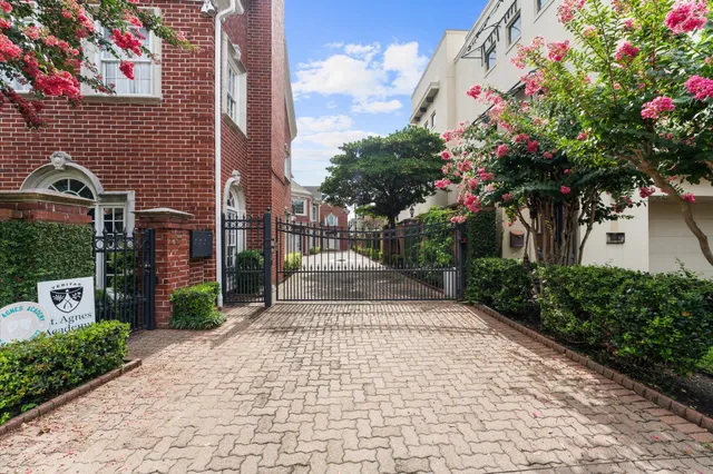 a front view of a house with a yard and flowers