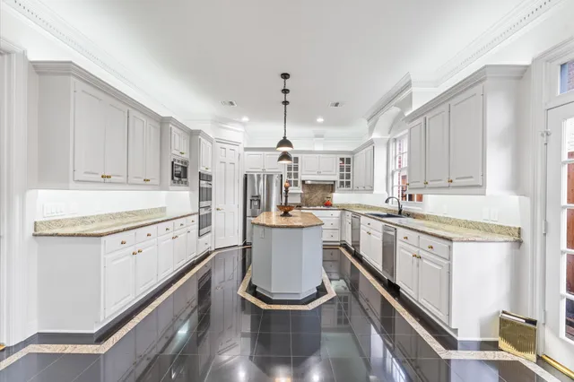 a kitchen with a sink stove and cabinets
