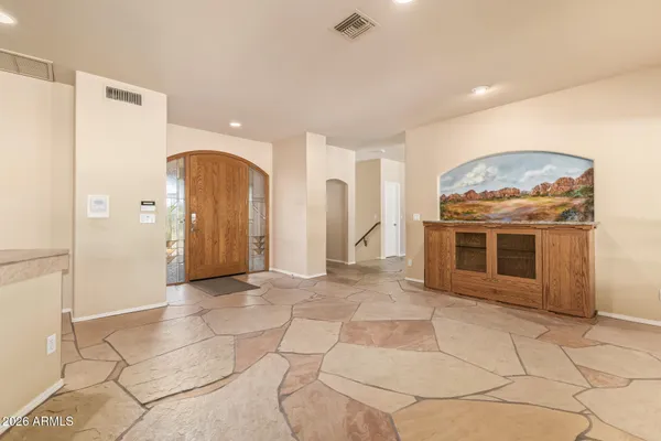 a large kitchen with stainless steel appliances kitchen island granite countertop a large counter top cabinets and stainless steel appliances