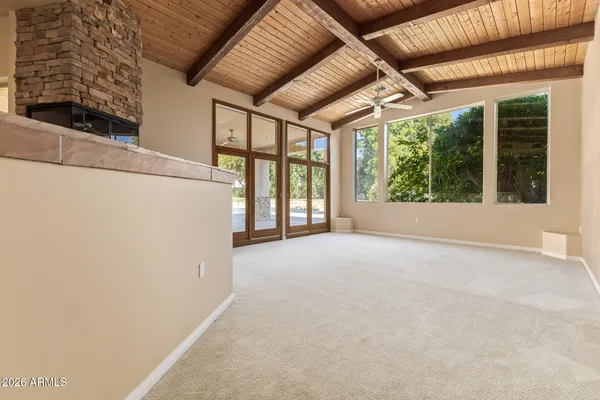 a large kitchen with stainless steel appliances kitchen island granite countertop a refrigerator and a stove top oven