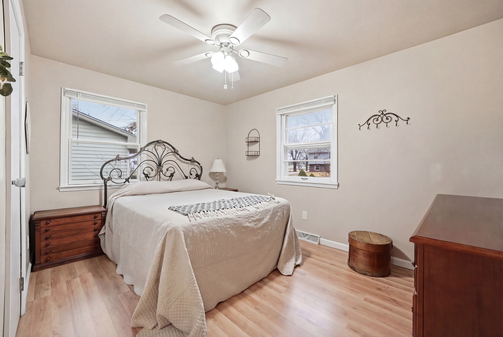 200 Ramona Avenue Rochelle, IL 61068 - Photo 15 of 21 a bedroom with a large bed and a chandelier