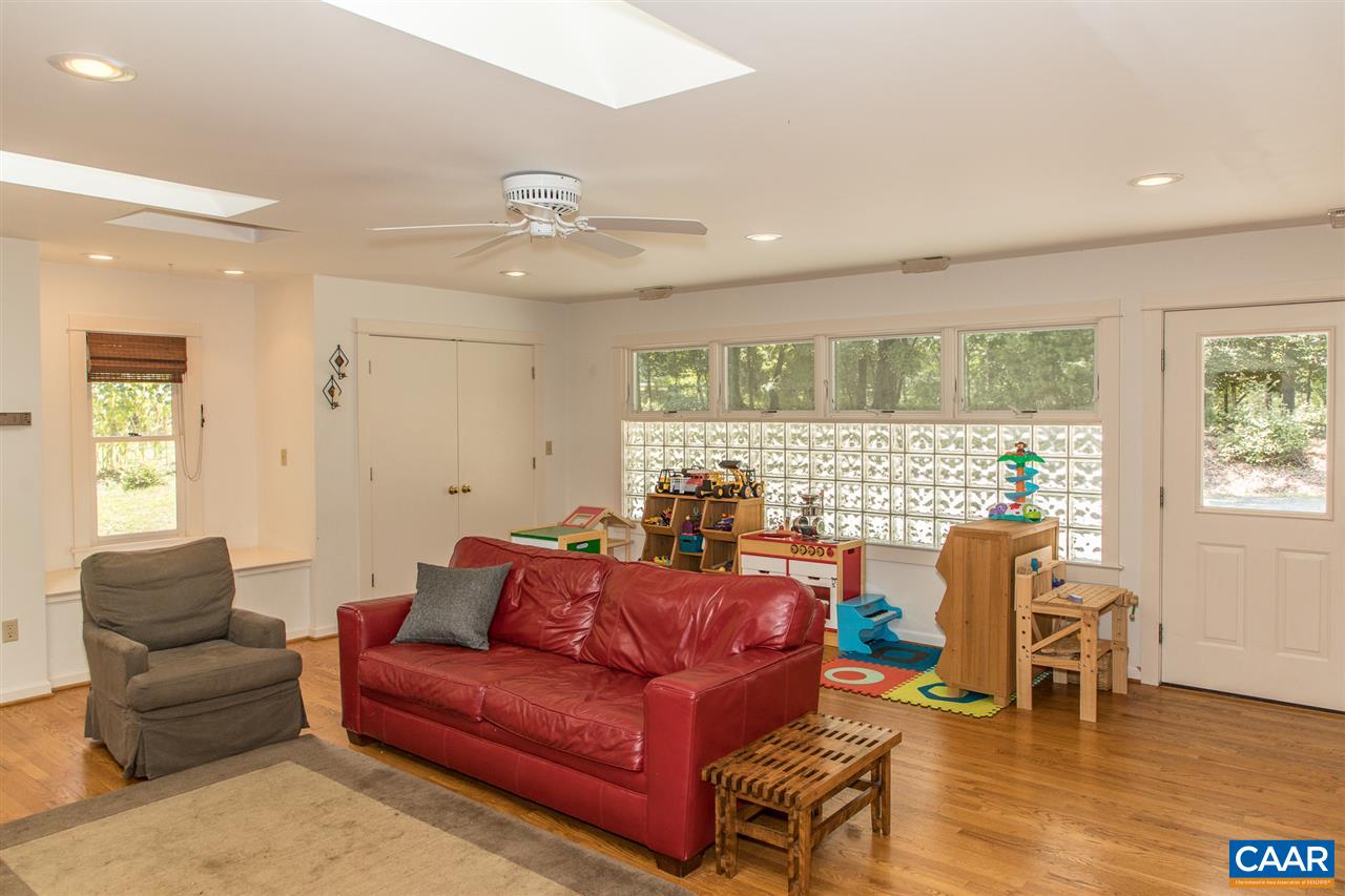 2227 Miller Lake Road Afton, VA 22920 - Photo 16 of 45 a living room with furniture and wooden floor