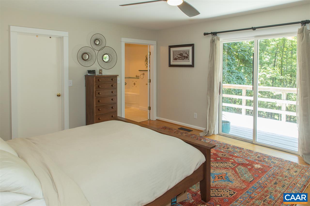 2227 Miller Lake Road Afton, VA 22920 - Photo 24 of 45 a bedroom with a bed and a window