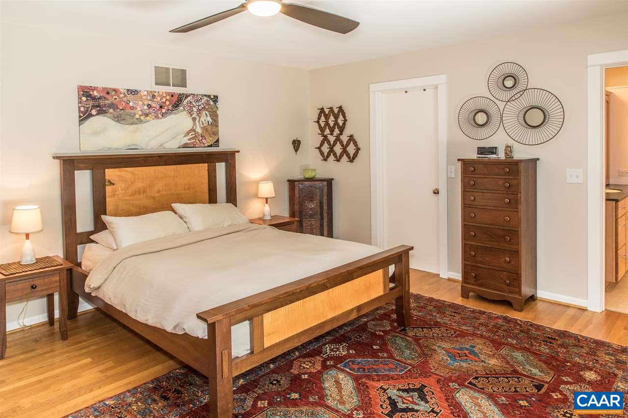 2227 Miller Lake Road Afton, VA 22920 - Photo 25 of 45 a bedroom with a bed and a lamp on dresser