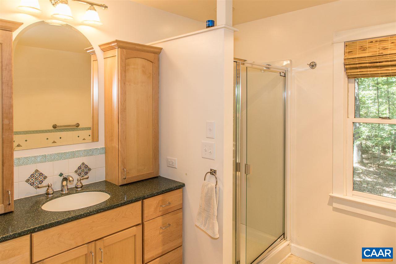 2227 Miller Lake Road Afton, VA 22920 - Photo 27 of 45 a bathroom with a granite countertop sink and a mirror