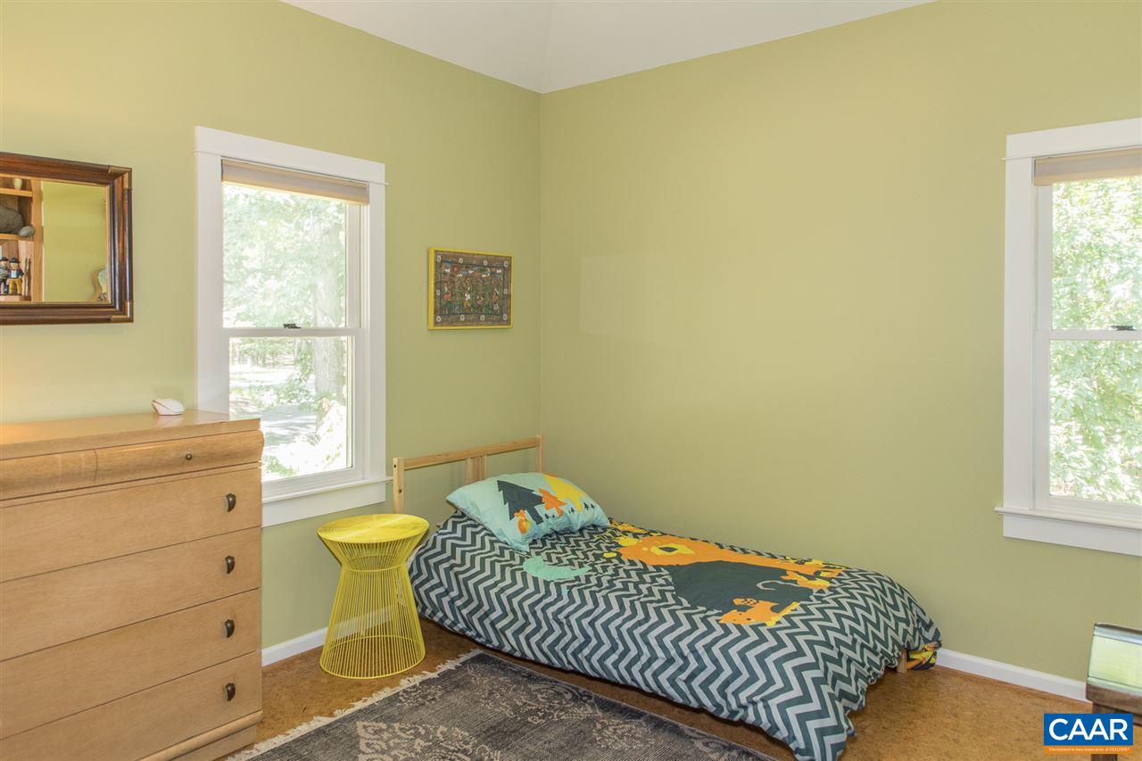 2227 Miller Lake Road Afton, VA 22920 - Photo 32 of 45 a bedroom with a bed and a window