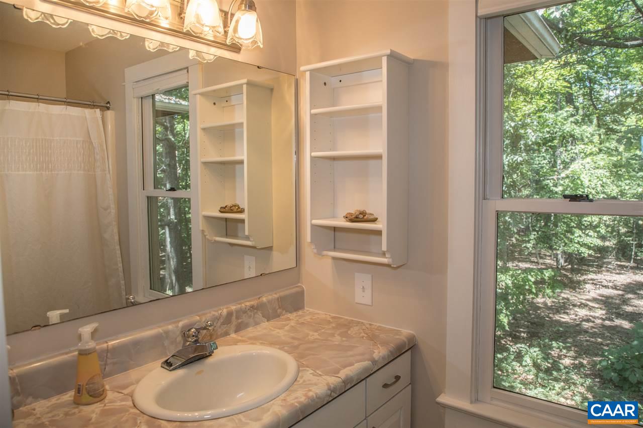 2227 Miller Lake Road Afton, VA 22920 - Photo 33 of 45 a bathroom with a granite countertop sink and a mirror