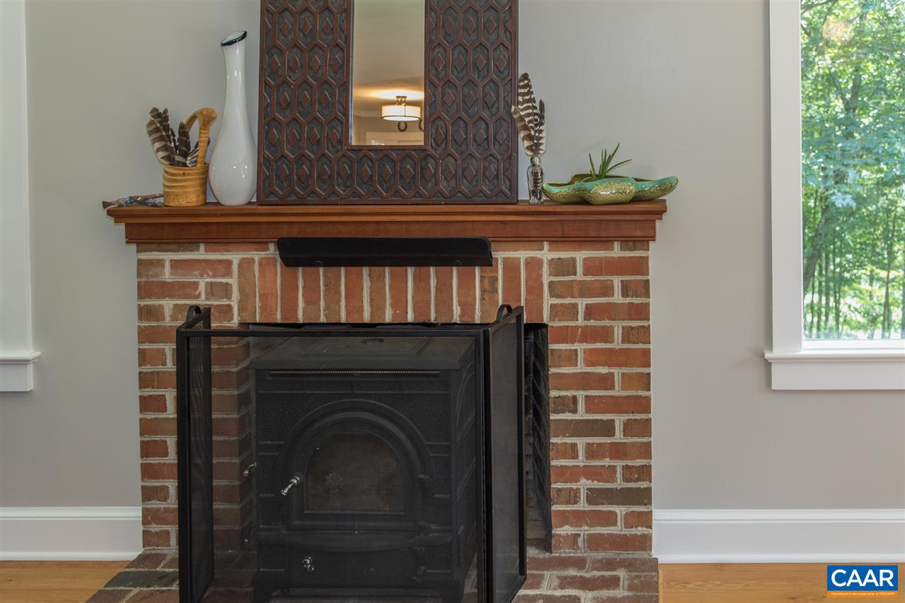 2227 Miller Lake Road Afton, VA 22920 - Photo 9 of 45 a view of a livingroom with a fireplace and window