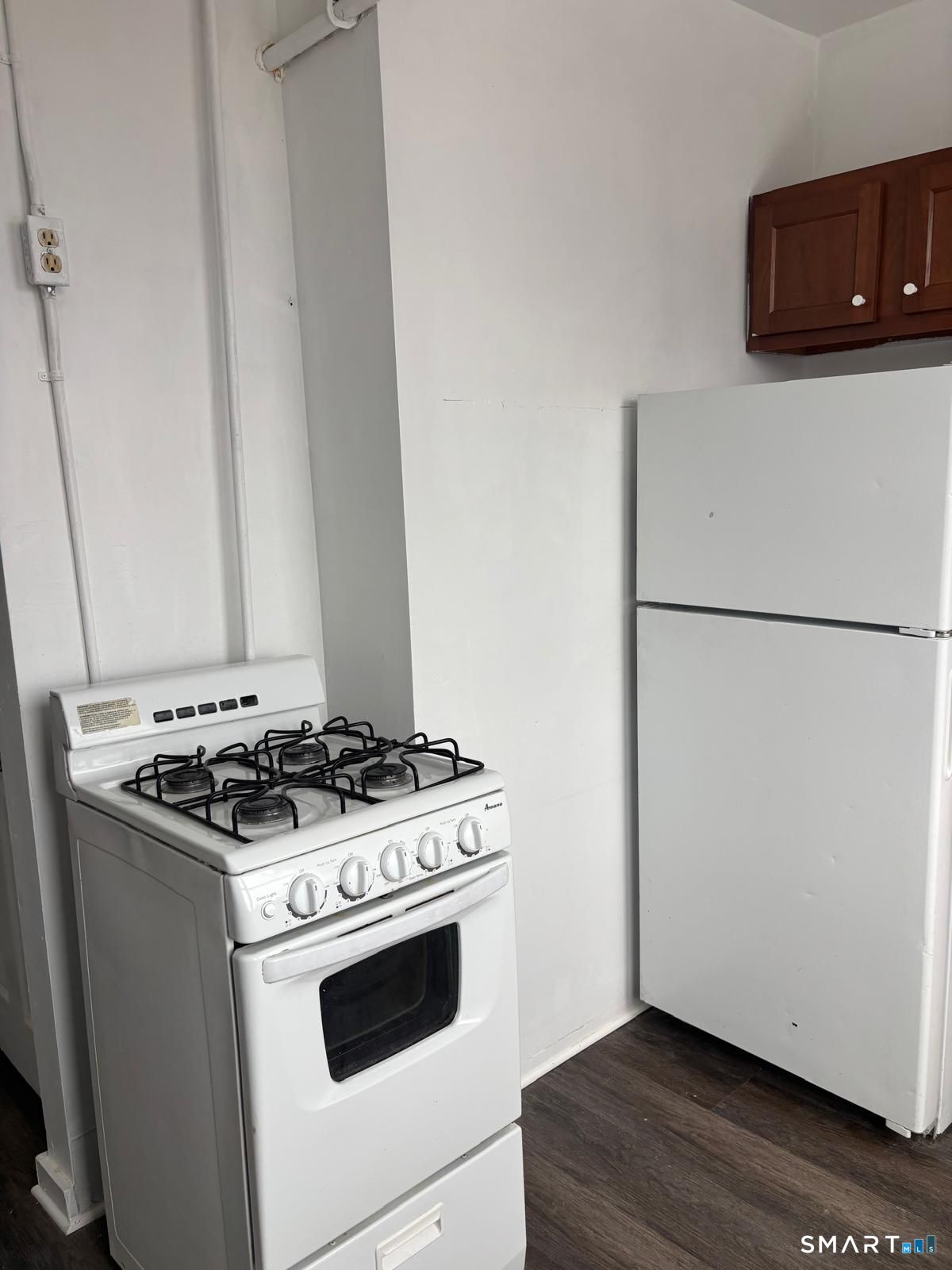 86 Pequonnock Street, Unit 20 Bridgeport, CT 06604 - Photo 1 of 5 a stove top oven sitting inside of a kitchen