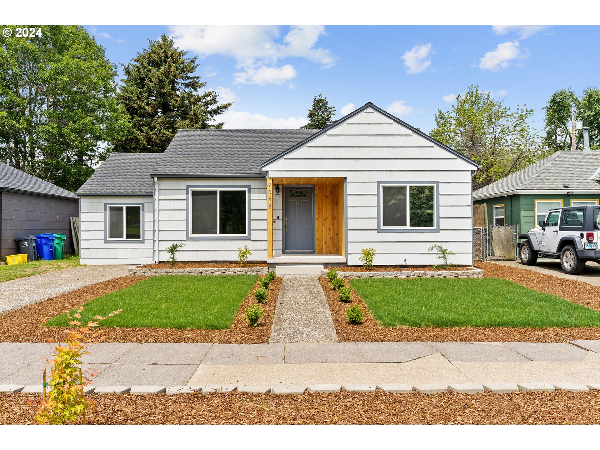 a view of a yard and front view of a house