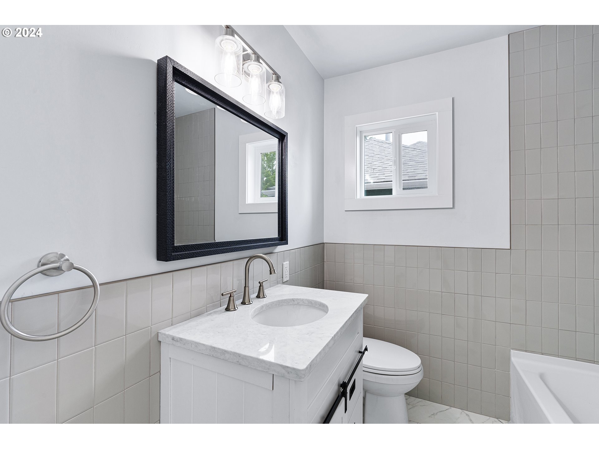 9045 Southeast Morrison Street Portland, OR 97216 - Photo 17 of 35 a bathroom with a sink vanity mirror and toilet