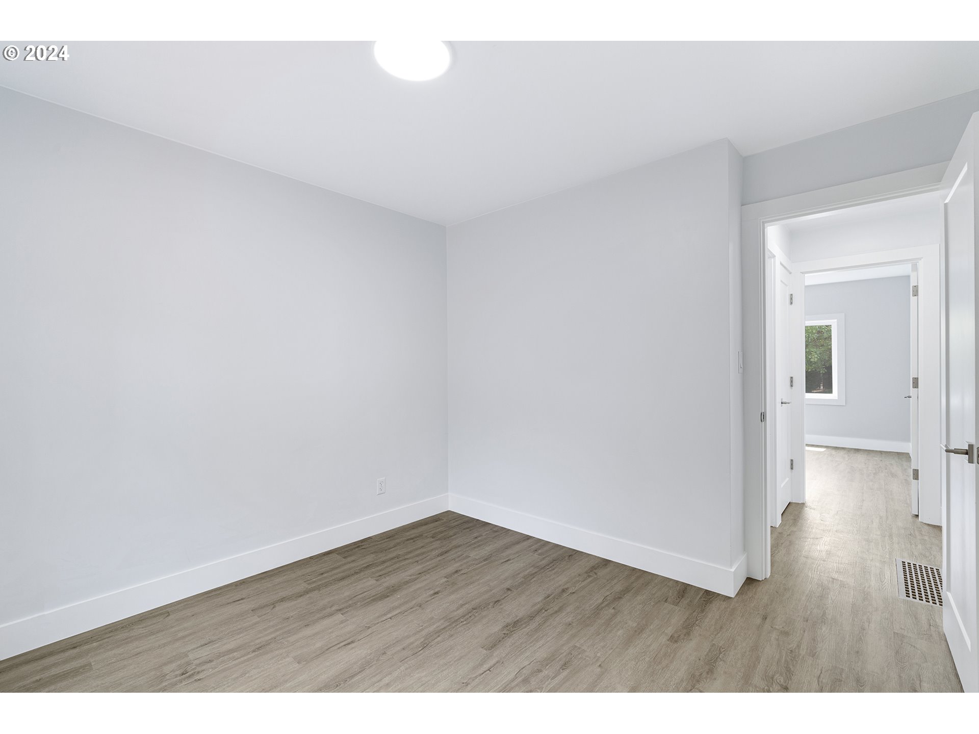 9045 Southeast Morrison Street Portland, OR 97216 - Photo 20 of 35 a view of an empty room and wooden floor