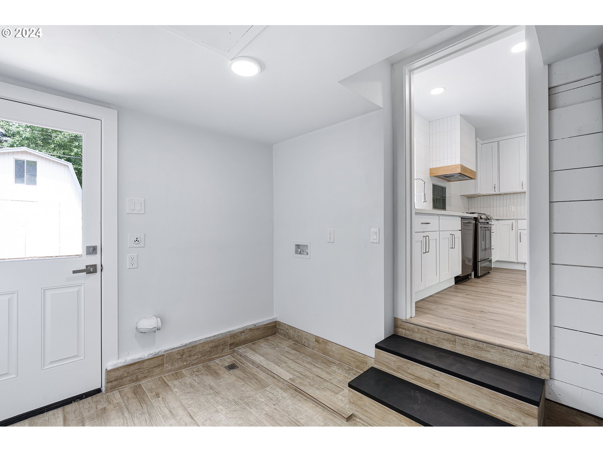9045 Southeast Morrison Street Portland, OR 97216 - Photo 23 of 35 a view of kitchen and wooden floor