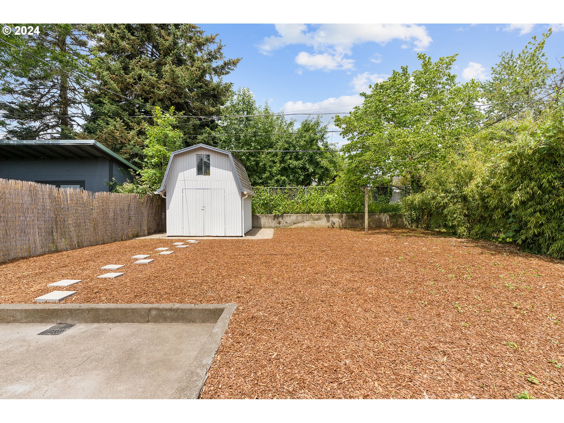 9045 Southeast Morrison Street Portland, OR 97216 - Photo 29 of 35 a view of a backyard of a house