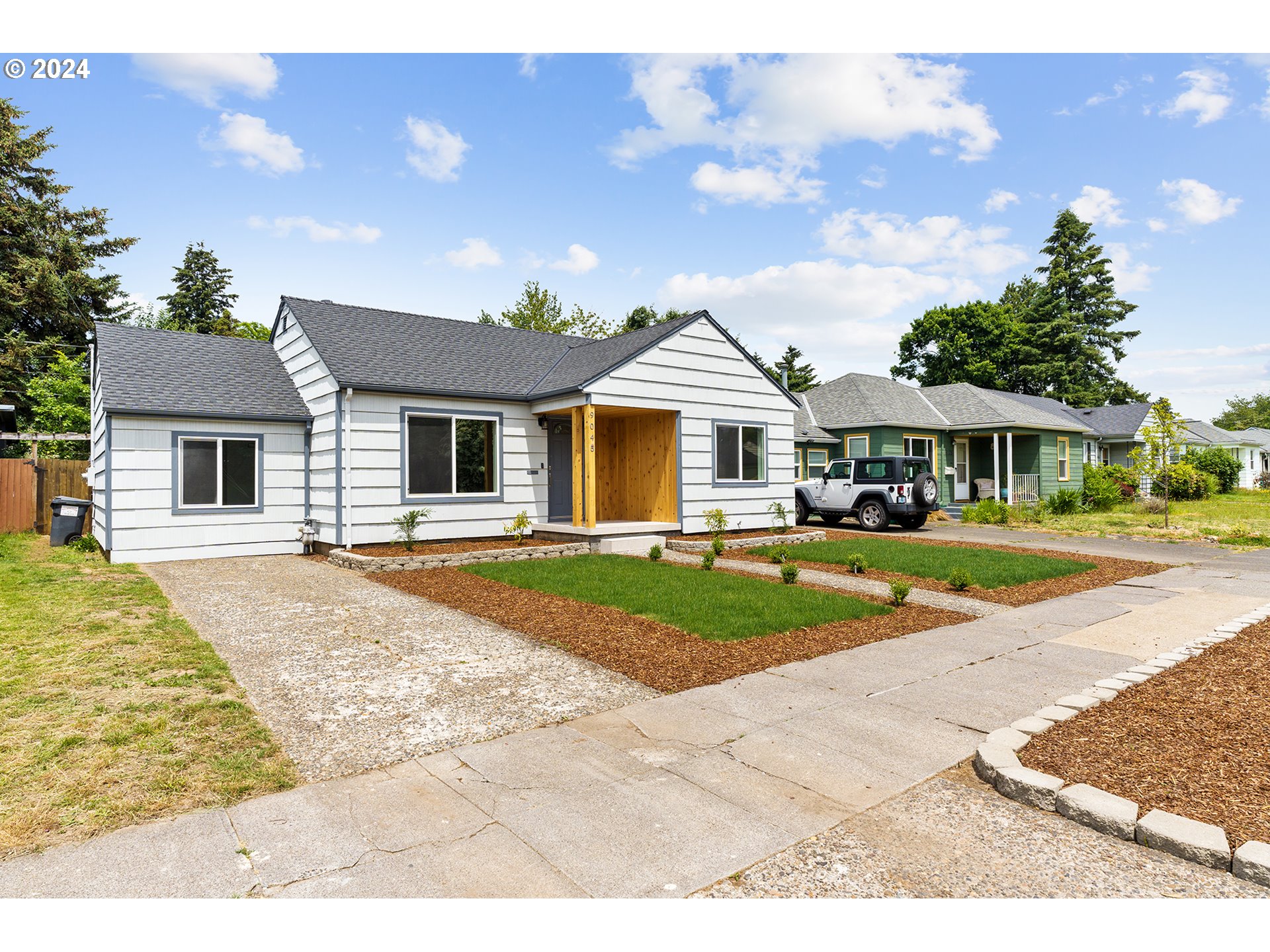 9045 Southeast Morrison Street Portland, OR 97216 - Photo 3 of 35 a front view of a house with a yard