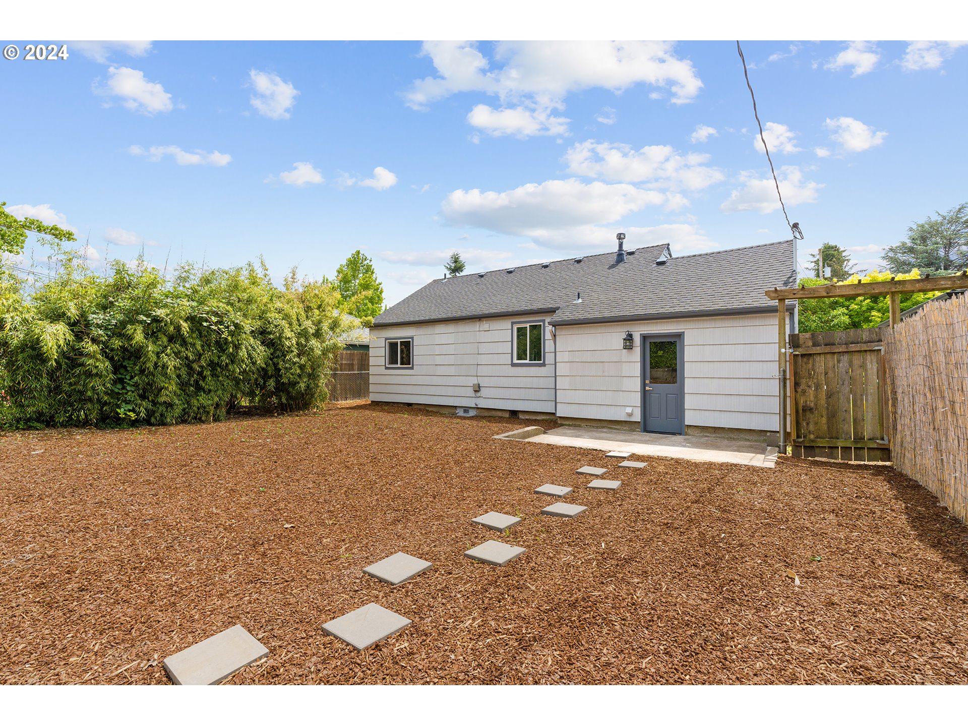 9045 Southeast Morrison Street Portland, OR 97216 - Photo 33 of 35 a view of a house with a yard and garage