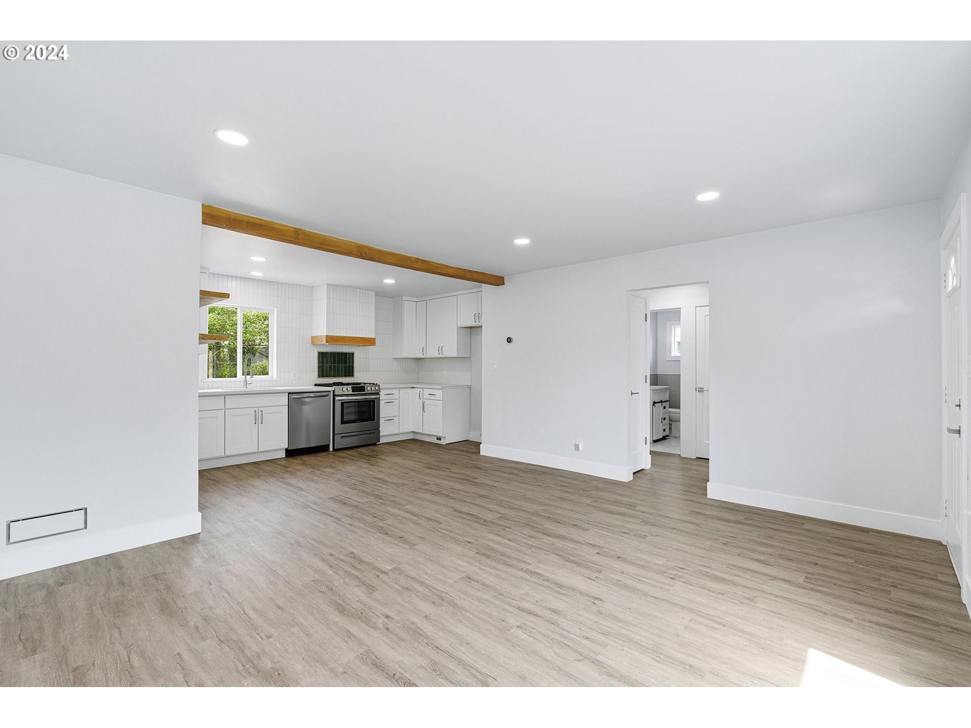 9045 Southeast Morrison Street Portland, OR 97216 - Photo 6 of 35 a view of a kitchen with a sink and a window