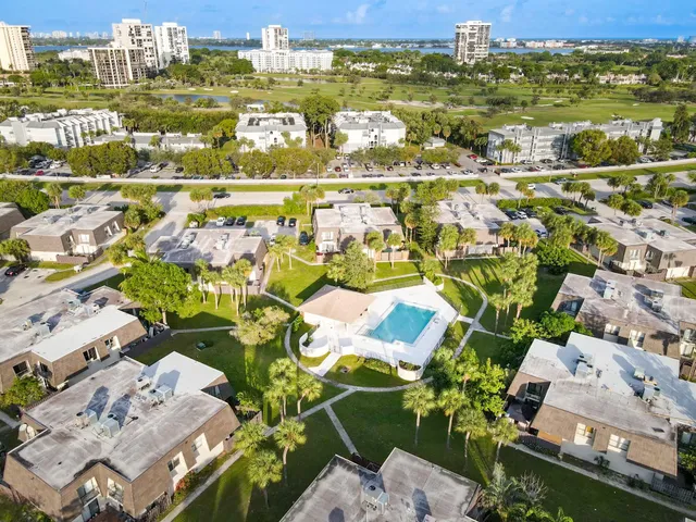 an aerial view of residential building and ocean