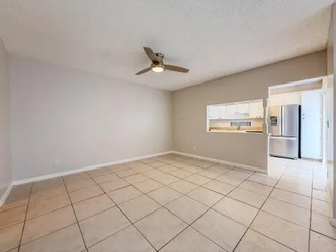 a kitchen with stainless steel appliances granite countertop a refrigerator sink and stove