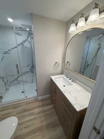 a bathroom with a double vanity sink and mirror