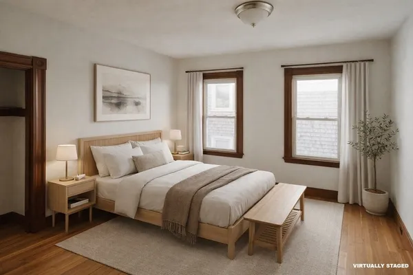 a bedroom with bed and window